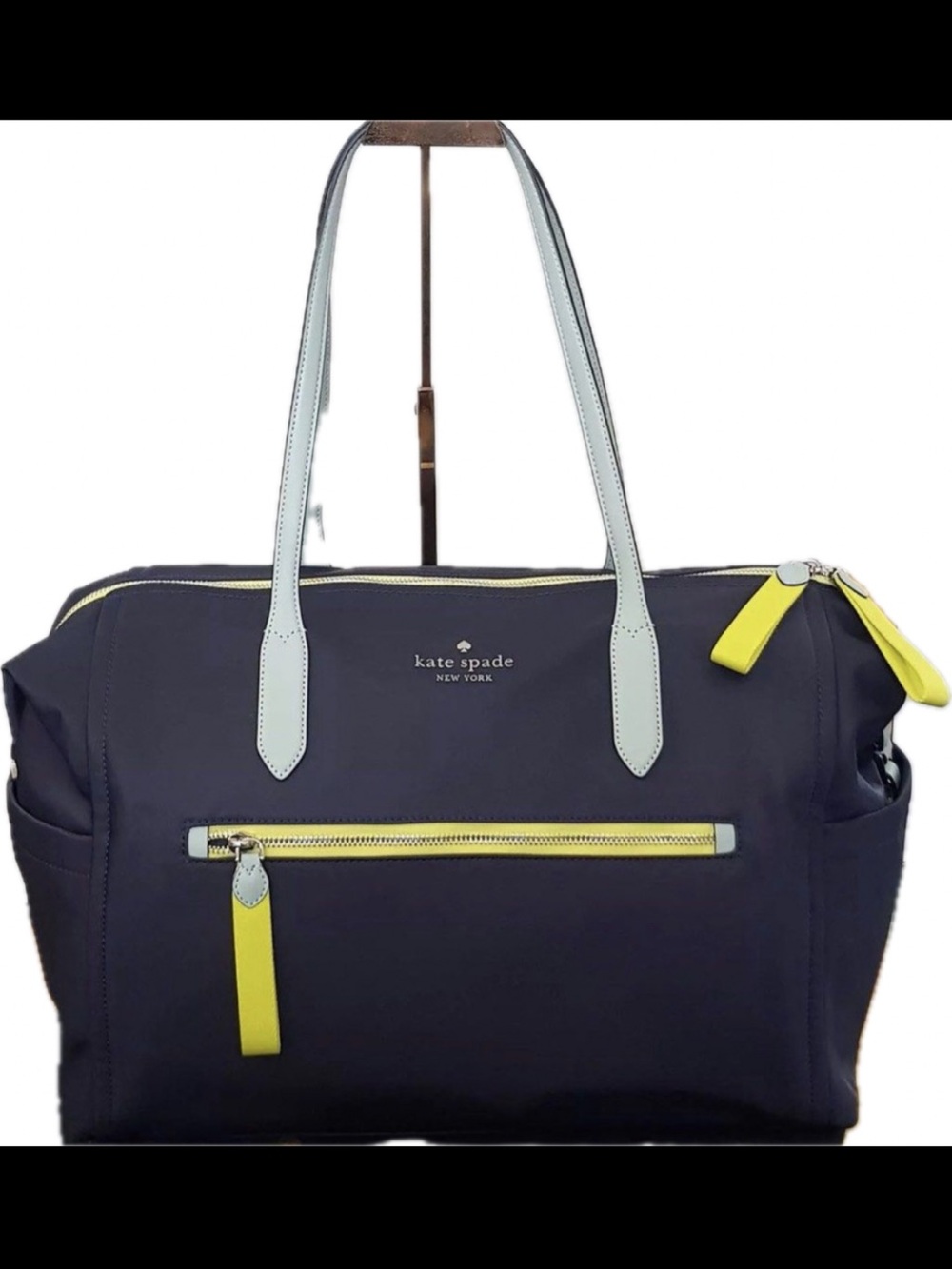 kate spade navy tote with yellow trim and light blue handles